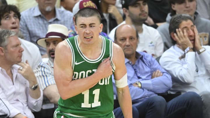 May 13, 2024; Cleveland, Ohio, USA; Boston Celtics guard Payton Pritchard (11) celebrates his three-point basket in the third quarter of game four of the second round for the 2024 NBA playoffs against the Cleveland Cavaliers at Rocket Mortgage FieldHouse. Mandatory Credit: David Richard-USA TODAY Sports