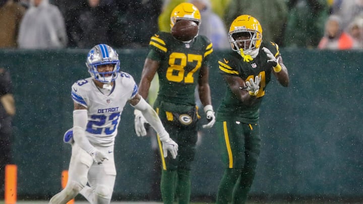 Green Bay Packers wide receiver Jayden Reed (11) makes a reception along the sideline against the Detroit Lions on Nov. 3.