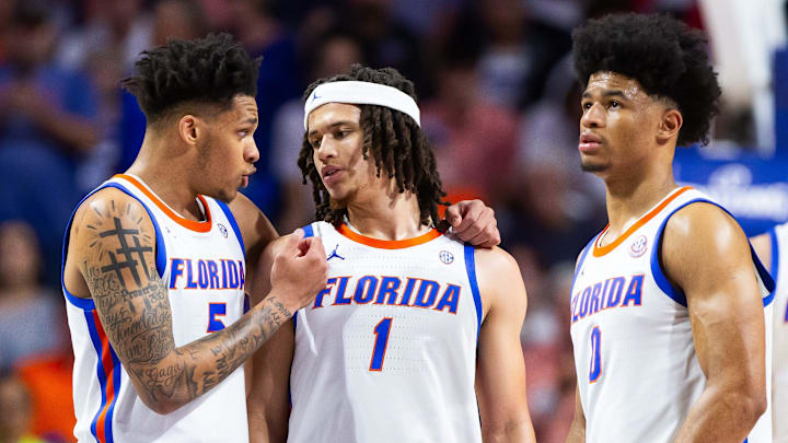 Florida Gators guard Will Richard (5) encourages Florida Gators guard Walter Clayton Jr. (1) during
