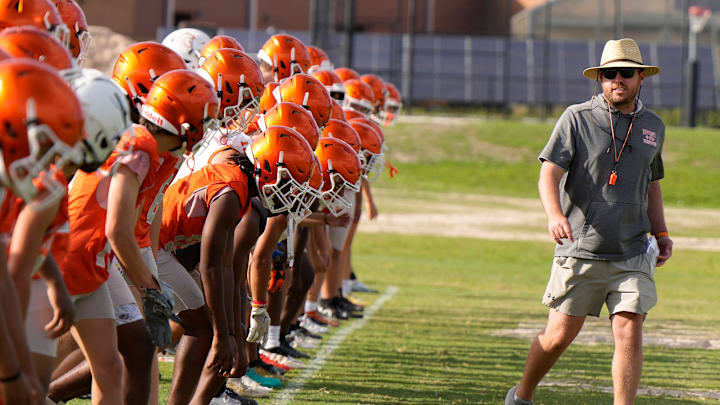 University High School head football coach Justin Roberts, shown here during spring football practice at the school in Orange City, in April of 2023, resigned on Monday after leading the Titans to a 19-5 record and back-to-back playoff appearances in two seasons.