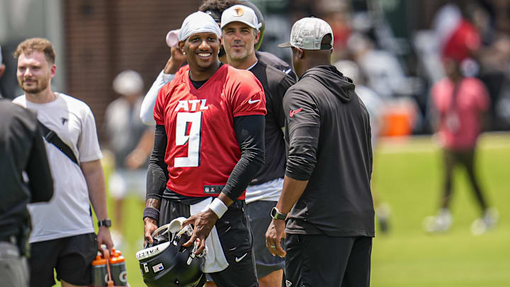 Jun 11, 2025; Atlanta, GA, USA; Atlanta Falcons quarterback Michael Penix Jr. (9) and head coach Raheem Morris on the field during Minicamp at Children's Healthcare of Atlanta Training Ground. Mandatory Credit: Dale Zanine-Imagn Images