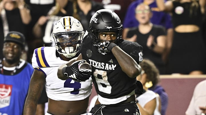 Oct 26, 2024; College Station, Texas, USA; Texas A&M Aggies running back Le'Veon Moss (8) reacts against the LSU Tigers during the third quarter. The Aggies defeated the Tigers 38-23; at Kyle Field. Mandatory Credit: Maria Lysaker-Imagn Images.