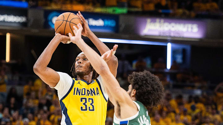 May 2, 2024; Indianapolis, Indiana, USA; Indiana Pacers center Myles Turner (33) shoots the ball while Milwaukee Bucks guard Andre Jackson Jr. (44) defends during game six of the first round for the 2024 NBA playoffs at Gainbridge Fieldhouse. Mandatory Credit: Trevor Ruszkowski-Imagn Images May 2, 2024; Indianapolis, Indiana, USA; Indiana Pacers center Myles Turner (33) shoots the ball while Milwaukee Bucks guard Andre Jackson Jr. (44) defends during game six of the first round for the 2024 NBA playoffs at Gainbridge Fieldhouse. Mandatory Credit: Trevor Ruszkowski-Imagn Images