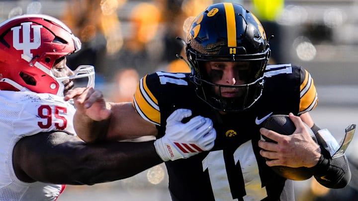 Iowa Hawkeyes quarterback Mark Gronowski (11) runs the ball against the Indiana Hoosiers Sept. 27, 2025 at Kinnick Stadium in Iowa City, Iowa.