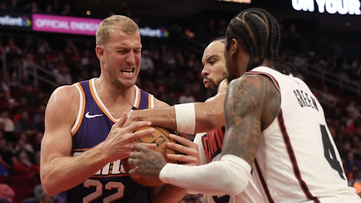 Feb 12, 2025; Houston, Texas, USA; Phoenix Suns center Mason Plumlee (22) and Houston Rockets forward Dillon Brooks (9) and  guard Jalen Green (4) fight over a rebound in the second quarter at Toyota Center. Mandatory Credit: Thomas Shea-Imagn Images