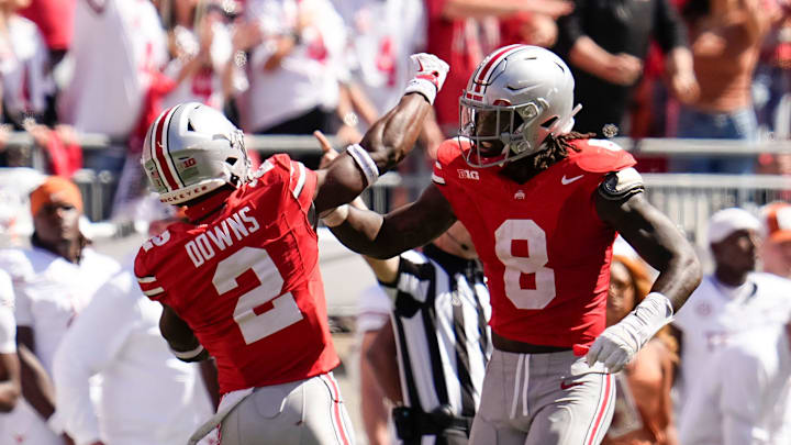 Ohio State Buckeyes safety Caleb Downs (2) and linebacker Arvell Reese (8) celebrate during the second half of the NCAA football game against the Texas Longhorns at Ohio Stadium on Aug. 30, 2025. Ohio State won 14-7.