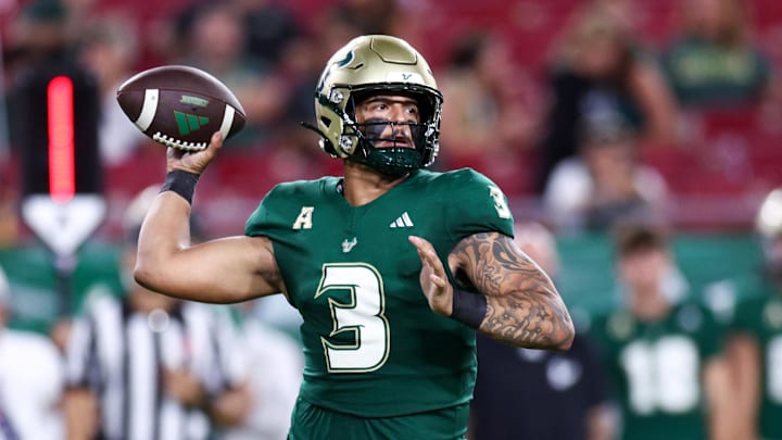 South Florida Bulls quarterback Bryce Archie (3) drops back to pass against the Miami Hurricanes in the fourth quarter at Raymond James Stadium. Credit: Nathan Ray Seebeck-Imagn Images