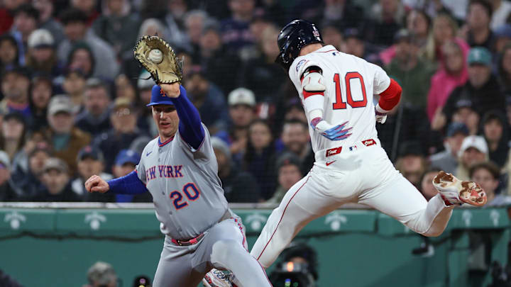 May 20, 2025; Boston, Massachusetts, USA; Boston Red Sox shortstop Trevor Story (10) tries to beat a throw to New York Mets first baseman Pete Alonso (20) during the fourth inning at Fenway Park. Mandatory Credit: Paul Rutherford-Imagn Images