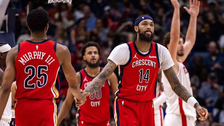 Dec 23, 2023; New Orleans, Louisiana, USA; New Orleans Pelicans forward Brandon Ingram (14) celebrates with guard Trey Murphy III (25) after a play against the Houston Rockets during the second half at Smoothie King Center. Mandatory Credit: Stephen Lew-Imagn Images