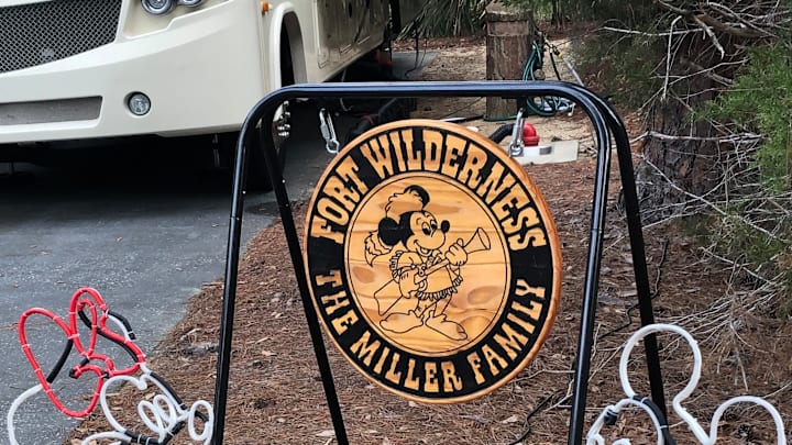 A guest at Fort Wilderness campgrounds decorates their RV pad with Mickey and Minnie Mouse.