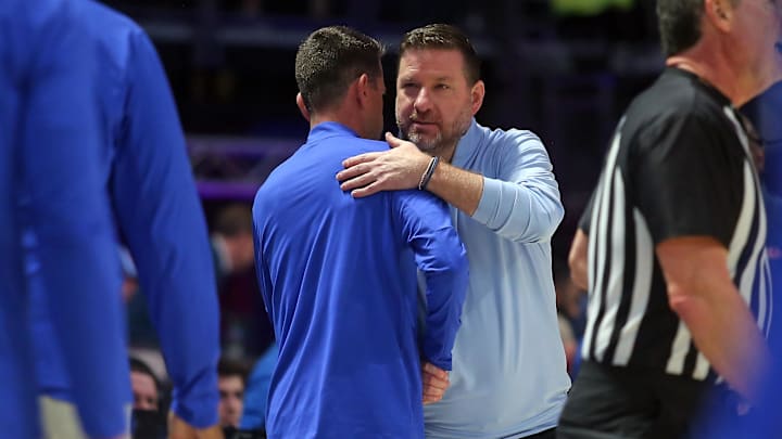 Feb 21, 2026; Oxford, Mississippi, USA; Mississippi Rebels head coach Chris Beard (right) embraces with Florida Gators head coach Todd Golden (left) after the game at The Sandy and John Black Pavilion at Ole Miss. Mandatory Credit: Petre Thomas-Imagn Images Feb 21, 2026; Oxford, Mississippi, USA; Mississippi Rebels head coach Chris Beard (right) embraces with Florida Gators head coach Todd Golden (left) after the game at The Sandy and John Black Pavilion at Ole Miss. Mandatory Credit: Petre Thomas-Imagn Images