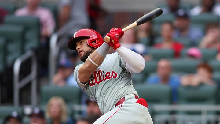 Jul 5, 2024; Atlanta, Georgia, USA; Philadelphia Phillies catcher Rafael Marchan (13) hits a single against the Atlanta Braves in the second inning at Truist Park. Mandatory Credit: Brett Davis-Imagn Images Jul 5, 2024; Atlanta, Georgia, USA; Philadelphia Phillies catcher Rafael Marchan (13) hits a single against the Atlanta Braves in the second inning at Truist Park. Mandatory Credit: Brett Davis-Imagn Images