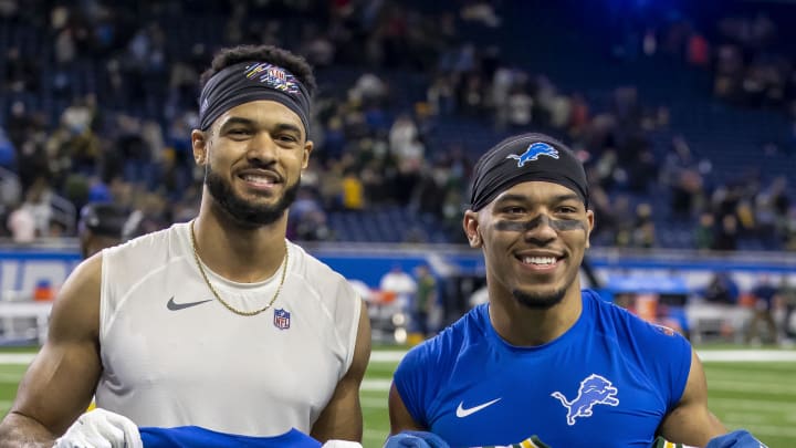 Lions wide receiver Amon-Ra St. Brown (14) and Packers wide receiver Equanimeous St. Brown (19) exchange jerseys