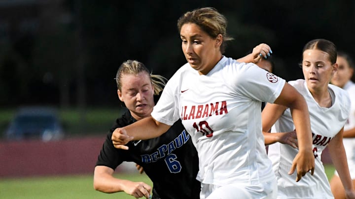 Alabama midfielder Nadia Ramadan (10) works the ball toward the goal as she is defended by DePaul  s Grace Menser. The Alabama Crimson Tide soccer team opened the 2023 season against DePaul Thursday, Aug. 17, 2023.