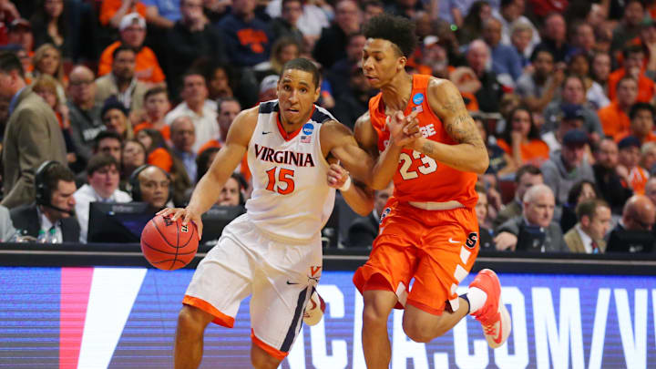 Mar 27, 2016; Chicago, IL, USA; Virginia Cavaliers guard Malcolm Brogdon (15) is defended by Syracuse Orange guard Malachi Richardson (23) during the second half in the championship game of the midwest regional of the NCAA Tournament at the United Center. Mandatory Credit: Dennis Wierzbicki-Imagn Images