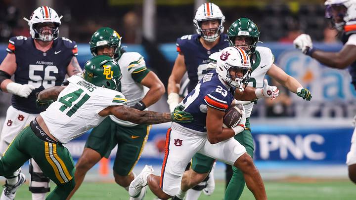 Auburn Tigers running back Jeremiah Cobb (23) runs the ball against the Baylor Bears in the third quarter at Mercedes-Benz Stadium. Mandatory Credit: Brett Davis-Imagn Images Auburn Tigers running back Jeremiah Cobb (23) runs the ball against the Baylor Bears in the third quarter at Mercedes-Benz Stadium. Mandatory Credit: Brett Davis-Imagn Images