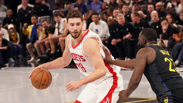 Nov 26, 2025; San Francisco, California, USA;  Houston Rockets center Alperen Sengun (28) dribbles while defended by Golden State Warriors forward Draymond Green (23) in the fourth quarter at Chase Center. Mandatory Credit: David Gonzales-Imagn Images