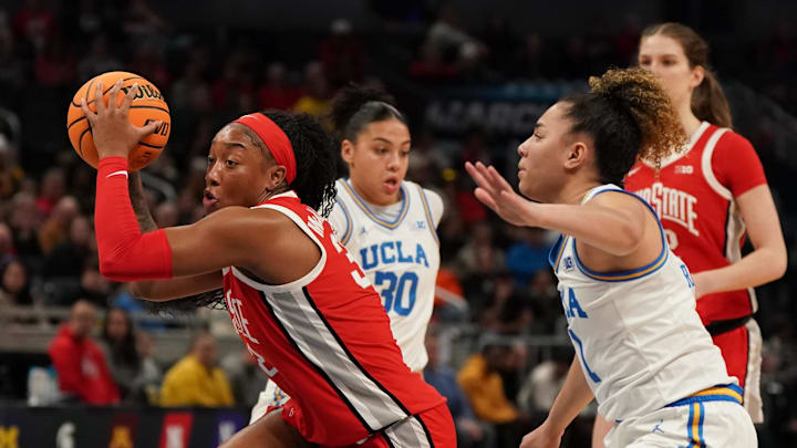 Mar 8, 2025; Indianapolis, IN, USA; UCLA Bruins guard Kiki Rice (1) defends against Ohio State Buckeyes forward Cotie McMahon (32) during the first half of the Big Ten Conference Tournament semifinals at Gainbridge Fieldhouse. Mandatory Credit: Stephanie Amador Blondet-Imagn Images