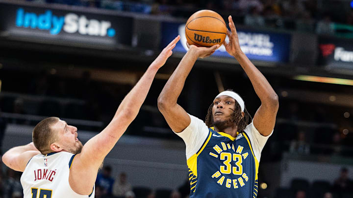 Feb 24, 2025; Indianapolis, Indiana, USA; Indiana Pacers center Myles Turner (33) shoots the ball while Denver Nuggets center Nikola Jokic (15) defends in the first half at Gainbridge Fieldhouse. Mandatory Credit: Trevor Ruszkowski-Imagn Images Feb 24, 2025; Indianapolis, Indiana, USA; Indiana Pacers center Myles Turner (33) shoots the ball while Denver Nuggets center Nikola Jokic (15) defends in the first half at Gainbridge Fieldhouse. Mandatory Credit: Trevor Ruszkowski-Imagn Images