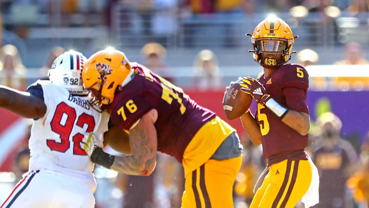 Nov 27, 2021; Tempe, Arizona, USA; Arizona State Sun Devils quarterback Jayden Daniels (5) throws a pass during the first half against the Arizona Wildcats at Sun Devil Stadium. Mandatory Credit: Mark J. Rebilas-Imagn Images