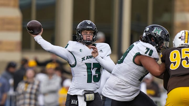 Nov 18, 2023; Laramie, Wyoming, USA; Hawaii Rainbow Warriors quarterback Brayden Schager (13) throws against the Wyoming Cowboys during the second quarter at Jonah Field at War Memorial Stadium. Mandatory Credit: Troy Babbitt-Imagn Images
