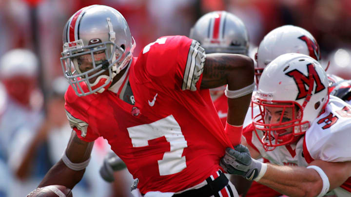 Ohio State's Ted Ginn Jr. is grabbed by Miami of Ohio's Steve Burke in the 1st quarter on a 25 yard pass to the Miami five yard line. This play set up the field goal that made the score 10-0 on September 4, 2005. Ohio State's Ted Ginn Jr. is grabbed by Miami of Ohio's Steve Burke in the 1st quarter on a 25 yard pass to the Miami five yard line. This play set up the field goal that made the score 10-0 on September 4, 2005.