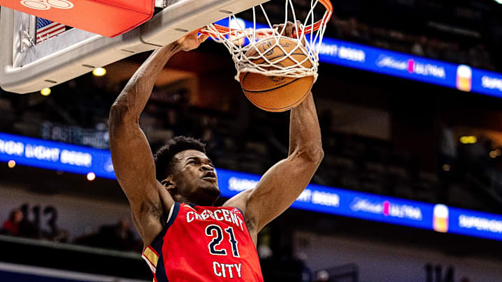 Dec 12, 2024; New Orleans, Louisiana, USA;  New Orleans Pelicans center Yves Missi (21) dunks the ball against Sacramento Kings forward Domantas Sabonis (11) during the first half at Smoothie King Center. Mandatory Credit: Stephen Lew-Imagn Images