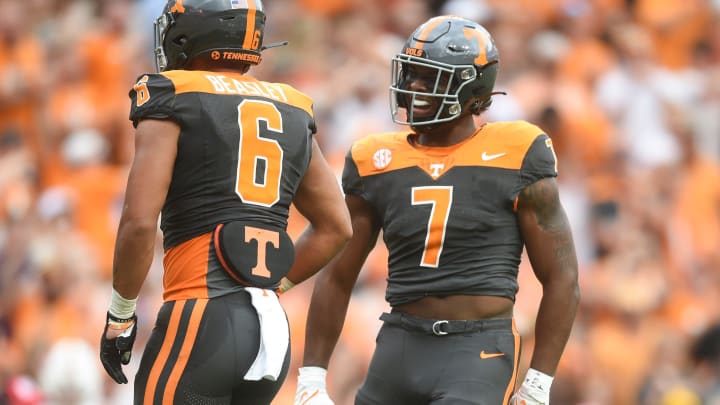 Tennessee linebacker Aaron Beasley (6) and Tennessee linebacker Arion Carter (7) react on the field