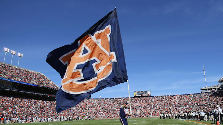 Nov 5, 2016; Auburn, AL, USA;   An Auburn Tigers cheerleader carries a flag through the endzone after the Tigers scored a touchdown against the Vanderbilt Commodores during the third quarter at Jordan Hare Stadium.  The Tigers beat the Commodores 23-16. Mandatory Credit: John Reed-Imagn Images