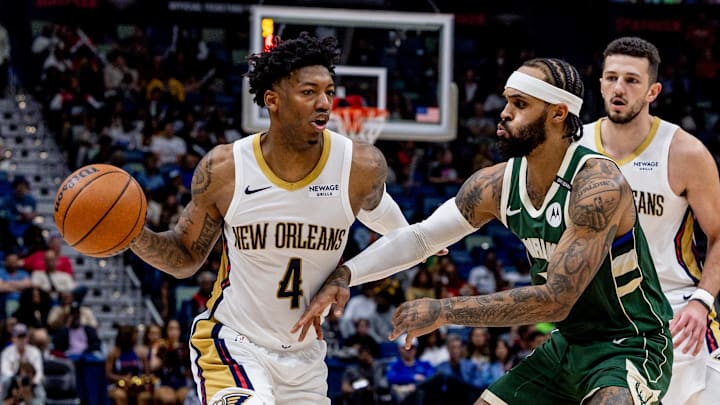 Apr 6, 2025; New Orleans, Louisiana, USA; New Orleans Pelicans guard Elfrid Payton (4) dribbles against Milwaukee Bucks guard Gary Trent Jr. (5) during the second half at Smoothie King Center. Mandatory Credit: Stephen Lew-Imagn Images