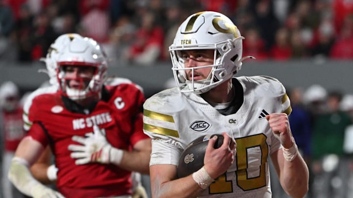 Nov 1, 2025; Raleigh, North Carolina, USA;  Georgia Tech Yellow Jackets quarterback Haynes King (10) reacts after scoring a touchdown during the fourth quarter at Carter-Finley Stadium. Mandatory Credit: Zachary Taft-Imagn Images