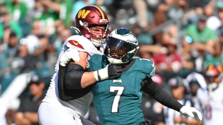 Oct 1, 2023; Philadelphia, Pennsylvania, USA; Philadelphia Eagles linebacker Haason Reddick (7) is blocked by Washington Commanders guard Andrew Wylie (71) at Lincoln Financial Field. Mandatory Credit: Eric Hartline-Imagn Images