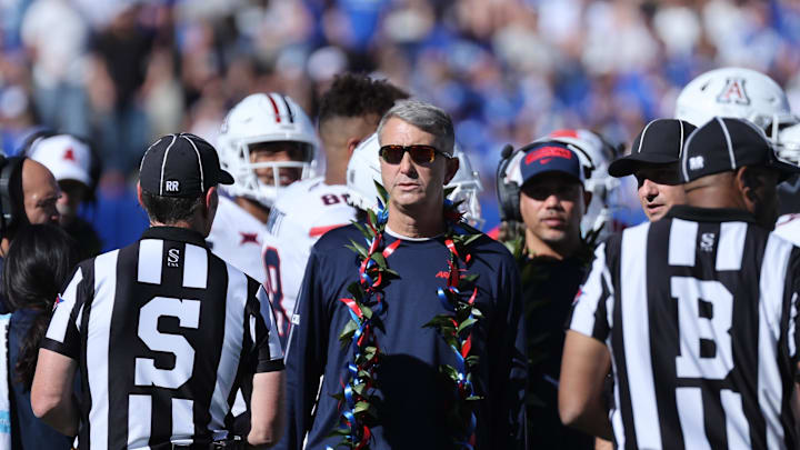 Oct 12, 2024; Provo, Utah, USA; Arizona Wildcats head coach Brent Brennan speaks with officials during the second quarter of the game against the Brigham Young Cougars at LaVell Edwards Stadium. Mandatory Credit: Rob Gray-Imagn Images