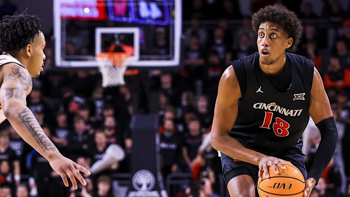 Jan 3, 2026; Cincinnati, Ohio, USA; Cincinnati Bearcats forward Baba Miller (18) holds the ball against the Houston Cougars in the second half at Fifth Third Arena. Mandatory Credit: Katie Stratman-Imagn Images