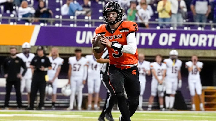 Solon quarterback Eli Kampman (3) looks to pass against the Nevada Cubs Nov. 15, 2025 during a Class 3A Iowa high school football semifinal at the UNI-Dome in Cedar Falls, Iowa.