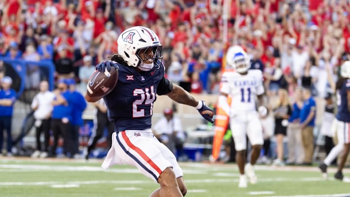 Nov 8, 2025; Tucson, Arizona, USA; Arizona Wildcats running back Quincy Craig (24) celebrates after rushing for a touchdown against the Kansas Jayhawks in the second half at Arizona Stadium. Mandatory Credit: Mark J. Rebilas-Imagn Images Nov 8, 2025; Tucson, Arizona, USA; Arizona Wildcats running back Quincy Craig (24) celebrates after rushing for a touchdown against the Kansas Jayhawks in the second half at Arizona Stadium. Mandatory Credit: Mark J. Rebilas-Imagn Images