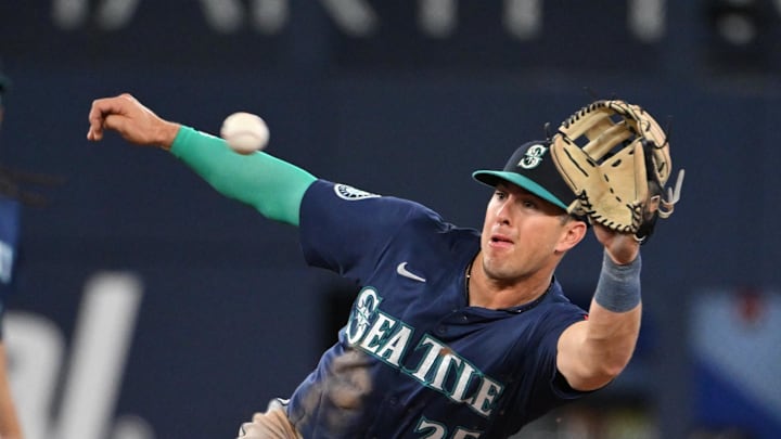 Seattle Mariners second baseman Dylan Moore (25) fields a throw to second as he prepares to nullify a stolen base by the Toronto Blue Jays in the eighth inning at Rogers Centre on April 19.
