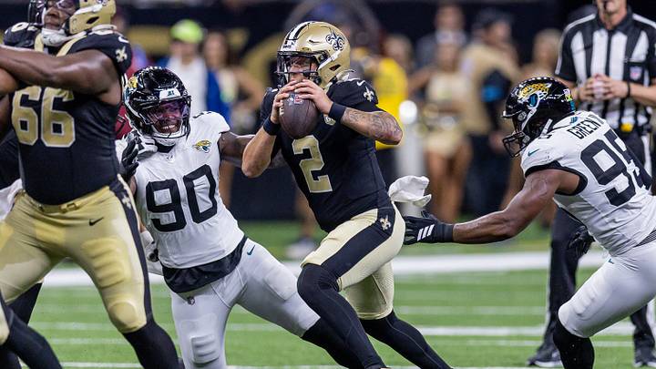 Aug 15, 2026; New Orleans, Louisiana, USA; New Orleans Saints quarterback Spencer Rattler (2) scrambles out the pocket against Jacksonville Jaguars defensive end Wesley Williams (90) during the first half at Caesars Superdome. Mandatory Credit: Stephen Lew-Imagn Images Aug 15, 2026; New Orleans, Louisiana, USA; New Orleans Saints quarterback Spencer Rattler (2) scrambles out the pocket against Jacksonville Jaguars defensive end Wesley Williams (90) during the first half at Caesars Superdome. Mandatory Credit: Stephen Lew-Imagn Images