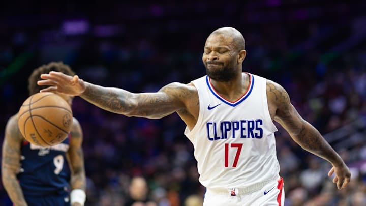 Mar 27, 2024; Philadelphia, Pennsylvania, USA; LA Clippers forward P.J. Tucker (17) reacts after being called for a foul against Philadelphia 76ers guard Kelly Oubre Jr. (9) during the second quarter at Wells Fargo Center. Mandatory Credit: Bill Streicher-Imagn Images
