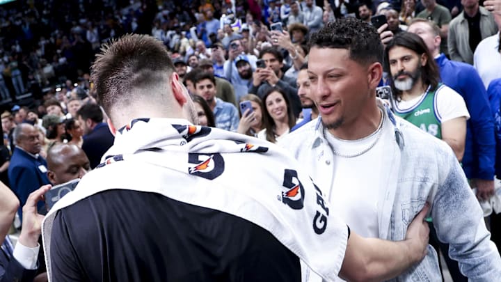 Apr 9, 2025; Dallas, Texas, USA;  Los Angeles Lakers guard Luka Doncic (77) hugs Kansas City Chiefs quarterback Patrick Mahomes after the game against the Dallas Mavericks at American Airlines Center. Mandatory Credit: Kevin Jairaj-Imagn Images
