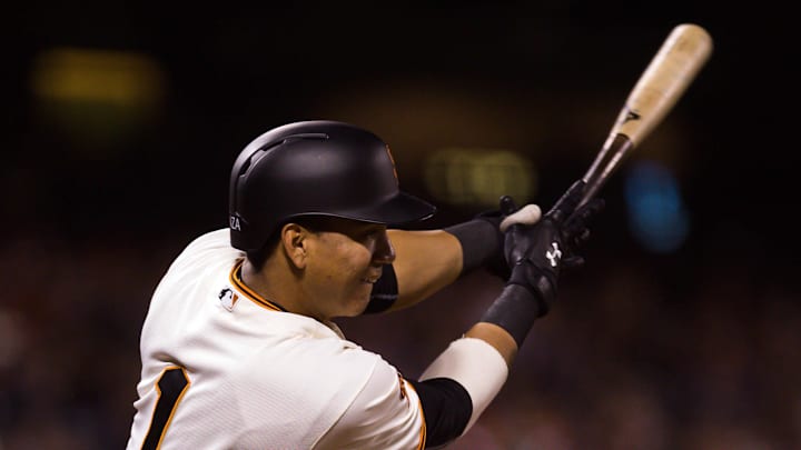 Sep 13, 2016; San Francisco, CA, USA; San Francisco Giants third baseman Ehire Adrianza (1) hits a single against the San Diego Padres during the sixth inning at AT&T Park. 