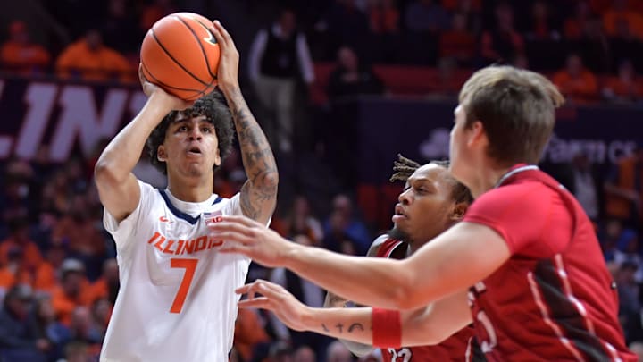 Nov 8, 2024; Champaign, Illinois, USA;  Illinois Fighting Illini forward Will Riley (7) shoots the ball over SIU Edwardsville Cougars forward Jo Valrie (33) during the first half at State Farm Center. Mandatory Credit: Ron Johnson-Imagn Images