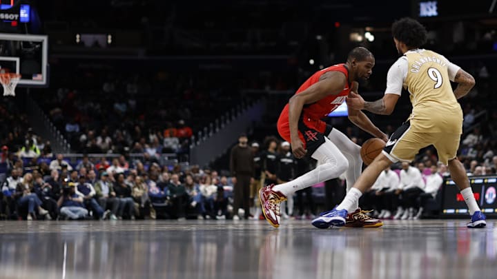 Mar 2, 2026; Washington, District of Columbia, USA; Houston Rockets forward Kevin Durant (7) dribbles the ball as Washington Wizards forward Justin Champagnie (9) defends in the second half at Capital One Arena. Mandatory Credit: Geoff Burke-Imagn Images