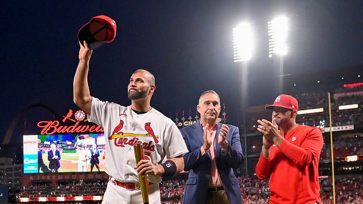 Sep 30, 2022; St. Louis, Missouri, USA;  (L-R) St. Louis Cardinals designated hitter Albert Pujols (5) waves to fans as president of baseball operations John Mozeliak and manager Oliver Marmol (37) look on during a ceremony to celebrate Albert Pujols 700th career home run before a game against the Pittsburgh Pirates at Busch Stadium. Mandatory Credit: Jeff Curry-USA TODAY Sports