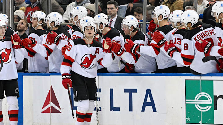 Dec 2, 2024; New York, New York, USA;  New Jersey Devils center Jack Hughes (86) celebrates his goal with teammates against the New York Rangers during the second period at Madison Square Garden. Mandatory Credit: Dennis Schneidler-Imagn Images