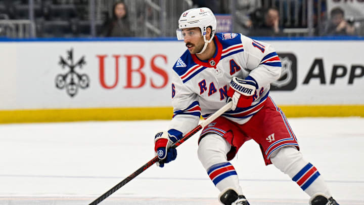 Jan 28, 2026; Elmont, New York, USA;  New York Rangers center Vincent Trocheck (16) skates with the puck against the New York Islanders during the third period at UBS Arena. Mandatory Credit: Dennis Schneidler-Imagn Images