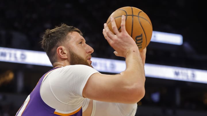 Apr 14, 2024; Minneapolis, Minnesota, USA; Phoenix Suns center Jusuf Nurkic (20) shoots against the Minnesota Timberwolves in the first quarter at Target Center. Mandatory Credit: Bruce Kluckhohn-USA TODAY Sports