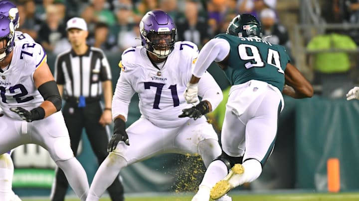 Sep 19, 2022; Philadelphia, Pennsylvania, USA;  Minnesota Vikings offensive tackle Christian Darrisaw (71) blocks Philadelphia Eagles defensive end Josh Sweat (94) at Lincoln Financial Field.