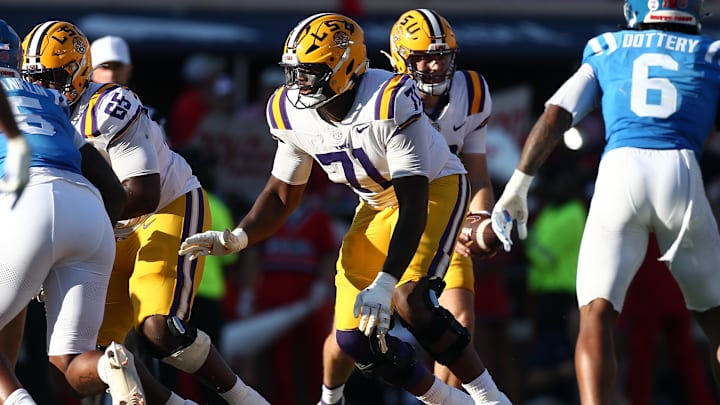 Sep 27, 2025; Oxford, Mississippi, USA; LSU Tigers offensive lineman Tyree Adams (71) blocks during the third quarter against the Mississippi Rebels at Vaught-Hemingway Stadium. Mandatory Credit: Petre Thomas-Imagn Images