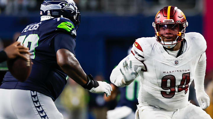 Nov 12, 2023; Seattle, Washington, USA; Seattle Seahawks offensive tackle Jason Peters (left) attempts to block Washington Commanders defensive tackle Daron Payne (94).